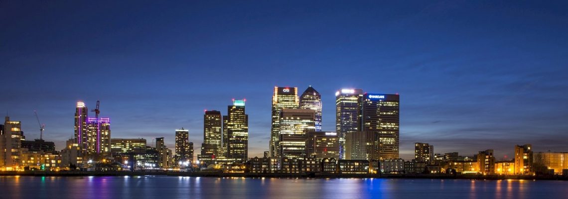 A night shot of Canary Wharf skyline. Book one our massage treatments with a sexy Japanese masseuse at the London Marriott Hotel West India Quay