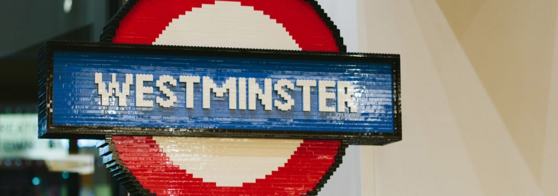 A Westminster Underground station sign made out of lego and in the same area where you can book a massage service of your choice